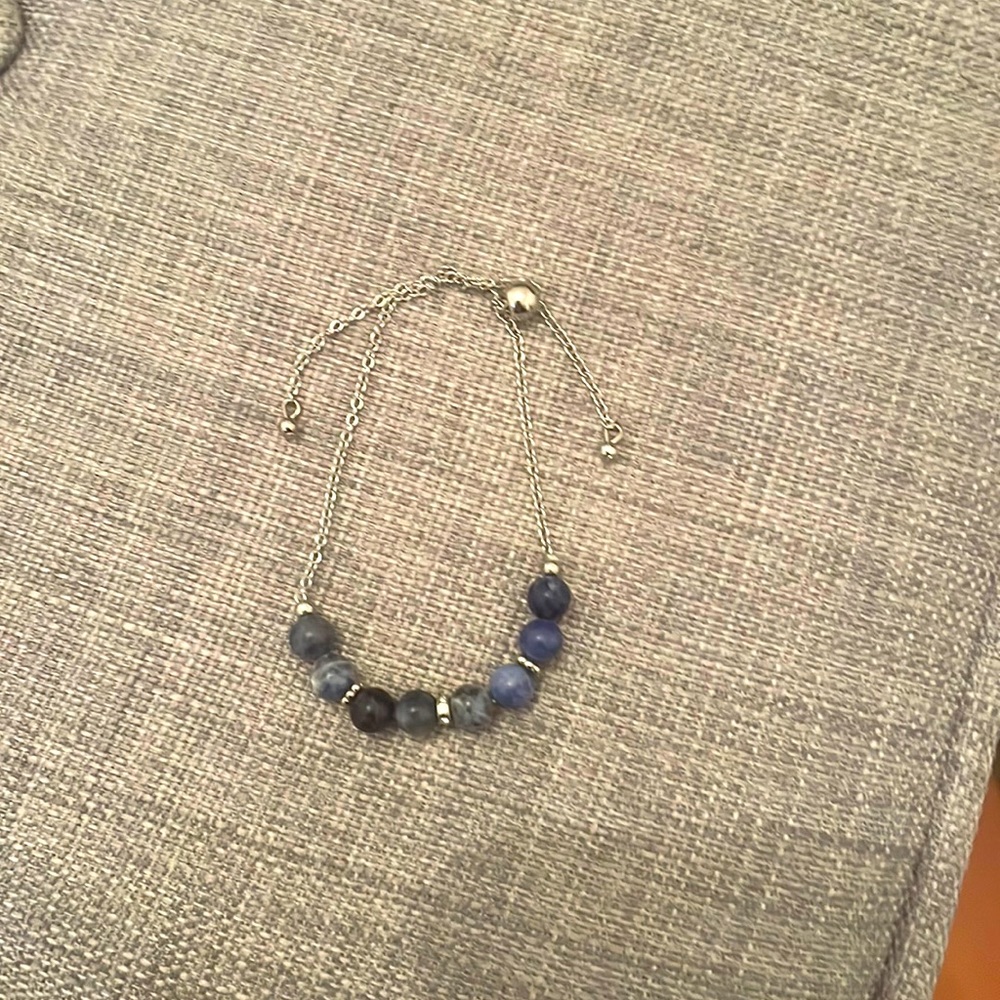 silver bracelet with blue spheres
